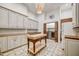 Bright laundry room with custom cabinets, butcher block countertops, decorative tile floors, and convenient washer and dryer at 25436 N 114Th St, Scottsdale, AZ 85255