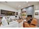 Spacious living room with fireplace and sliding doors to the patio at 25436 N 114Th St, Scottsdale, AZ 85255