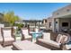 Outdoor patio area with comfortable wicker seating surrounding a sparkling pool at 25436 N 114Th St, Scottsdale, AZ 85255