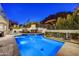 Backyard pool and lounging area features a built-in grill at 25436 N 114Th St, Scottsdale, AZ 85255