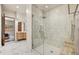 Updated shower with tile surround, glass door, and built-in seat at 25436 N 114Th St, Scottsdale, AZ 85255