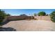 Backyard with gravel landscaping, block fence, and desert plants for low maintenance at 2803 W Angela Dr, Phoenix, AZ 85053