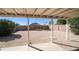 Backyard featuring a covered patio and a low-maintenance gravel landscape with desert plants at 2803 W Angela Dr, Phoenix, AZ 85053