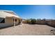 Backyard with gravel landscaping, a covered patio, and a block wall at 2803 W Angela Dr, Phoenix, AZ 85053