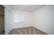 Bedroom with carpet, white walls, a window with blinds, and a closet with sliding doors at 2803 W Angela Dr, Phoenix, AZ 85053