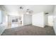 Bright living room with neutral carpet and sliding glass doors to the backyard at 2803 W Angela Dr, Phoenix, AZ 85053