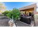 Backyard featuring a private hot tub area nestled amongst the desert landscape at 3055 N Red Mtn # 178, Mesa, AZ 85207