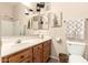 Bathroom featuring vanity, toilet, decorative art and wicker wastebasket at 3055 N Red Mtn # 178, Mesa, AZ 85207