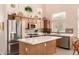 Bright kitchen offering updated appliances, ample cabinetry, and a stylish center island at 3055 N Red Mtn # 178, Mesa, AZ 85207