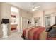 Comfortable main bedroom with a view into the bathroom and large mirrored closet at 3055 N Red Mtn # 178, Mesa, AZ 85207