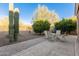 Outdoor patio area with mature trees and landscaping with table and chairs set at 3055 N Red Mtn # 178, Mesa, AZ 85207