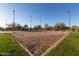 Sand volleyball court in a community recreation area with lighting and landscaping at 3055 N Red Mtn # 178, Mesa, AZ 85207