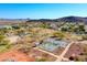 An aerial view featuring a community park, pickleball courts, and scenic mountain views at 3129 W Walter Way, Phoenix, AZ 85027