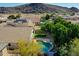 Relaxing backyard with a sparkling pool, mature trees, and a tranquil setting for outdoor living at 3129 W Walter Way, Phoenix, AZ 85027