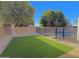 Backyard featuring artificial grass and a fenced pool at 3129 W Walter Way, Phoenix, AZ 85027