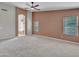 Spacious carpeted bedroom with walk through to the en suite bathroom at 3129 W Walter Way, Phoenix, AZ 85027