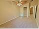 Bedroom features a ceiling fan, closet and neutral carpet at 3129 W Walter Way, Phoenix, AZ 85027