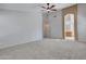 Large Primary bedroom featuring carpet, ceiling fan, and view to bathroom at 3129 W Walter Way, Phoenix, AZ 85027