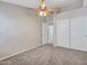 Neutral bedroom featuring a ceiling fan, carpeted floors and a closet at 3129 W Walter Way, Phoenix, AZ 85027