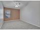 Neutral bedroom featuring a ceiling fan and a window with natural light at 3129 W Walter Way, Phoenix, AZ 85027