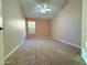 Bedroom with vaulted ceiling, fan, and a window at 3129 W Walter Way, Phoenix, AZ 85027