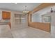 Dining area featuring tile flooring, wood trimmed windows and a chandelier at 3129 W Walter Way, Phoenix, AZ 85027