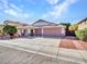 Charming home featuring a three car garage, desert landscaping, and a well-maintained exterior at 3129 W Walter Way, Phoenix, AZ 85027