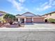 Attractive single-Gathering home with a three car garage, desert landscaping, and a neatly kept lawn at 3129 W Walter Way, Phoenix, AZ 85027