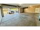 Large garage with storage cabinets and space for multiple vehicles at 3129 W Walter Way, Phoenix, AZ 85027