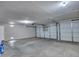 A clean and functional garage with an automatic door and plenty of open space for parking at 3129 W Walter Way, Phoenix, AZ 85027