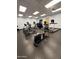 The fitness center features stationary bikes and ellipticals, with padded floors and multiple televisions at 3129 W Walter Way, Phoenix, AZ 85027