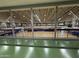 Second floor view of the community center gymnasium with basketball courts and upper level seating at 3129 W Walter Way, Phoenix, AZ 85027