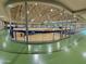 Community center gymnasium with hardwood court and seating on the upper level at 3129 W Walter Way, Phoenix, AZ 85027