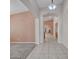 Bright hallway with tiled flooring that leads to other rooms in the house at 3129 W Walter Way, Phoenix, AZ 85027