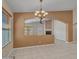 Dining room features tile flooring, chandelier and partial wall with archways to other rooms at 3129 W Walter Way, Phoenix, AZ 85027