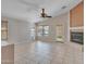 Bright living room features fireplace, tile flooring and windows for natural light at 3129 W Walter Way, Phoenix, AZ 85027