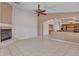 Open-concept living area with a fireplace and seamless flow into the adjacent kitchen at 3129 W Walter Way, Phoenix, AZ 85027