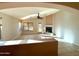 Cozy living room featuring tall ceilings, tile flooring, and a fireplace at 3129 W Walter Way, Phoenix, AZ 85027