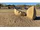 Community playground with creative rock sculptures, play equipment, and shade structures for children at 3129 W Walter Way, Phoenix, AZ 85027