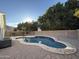 Private swimming pool with a gravel surround and mature trees at 3129 W Walter Way, Phoenix, AZ 85027