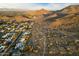 View of a desert neighborhood with mountain views and houses featuring pools and solar panels at 3348 E Eva St, Phoenix, AZ 85028