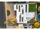 Aerial view of a home with solar panels, a well-manicured lawn, a pool, and a pristine white roof at 3348 E Eva St, Phoenix, AZ 85028