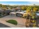 Stunning stone-accented home boasts solar panels, mature landscaping, and a spacious driveway at 3348 E Eva St, Phoenix, AZ 85028