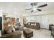 Comfortable living room showcasing a sofa, chairs, ceiling fan, and access to other areas at 3348 E Eva St, Phoenix, AZ 85028