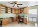 A bright and airy home office featuring custom built-in cabinets and shelving at 3348 E Eva St, Phoenix, AZ 85028