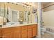 Bathroom featuring double sinks, vanity, and a shower-tub combination at 3350 W Ivanhoe Ct, Chandler, AZ 85226