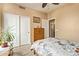 Bedroom with floral bedding, adjacent to closet, offering a serene retreat at 3350 W Ivanhoe Ct, Chandler, AZ 85226