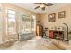 Spacious bonus room featuring a sewing machine, exercise equipment, and natural light at 3350 W Ivanhoe Ct, Chandler, AZ 85226