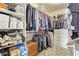 Walk-in closet with shelving, hanging racks, and a built-in wooden chest for storage at 3350 W Ivanhoe Ct, Chandler, AZ 85226