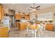 Bright kitchen with a central island, a dining table, and ample cabinet space, creating a welcoming and functional area at 3350 W Ivanhoe Ct, Chandler, AZ 85226